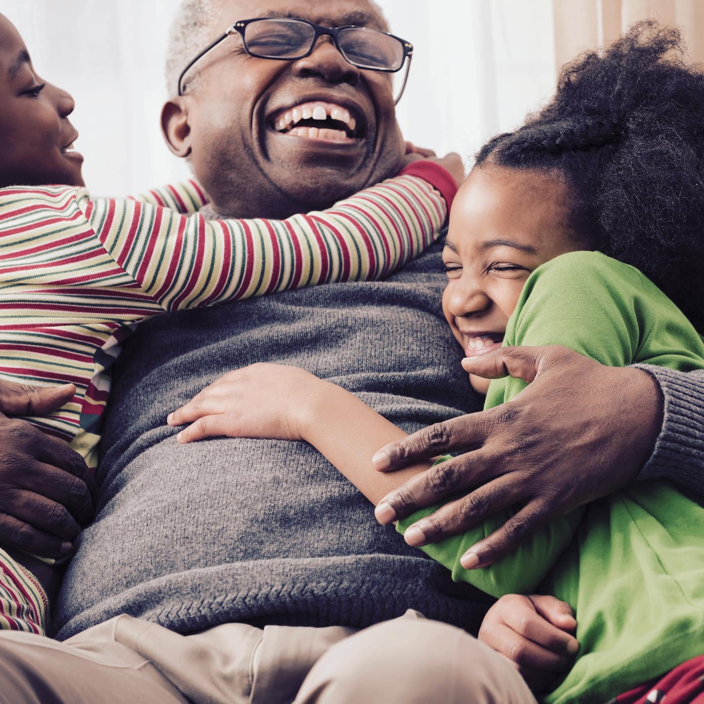 Children hugging family member